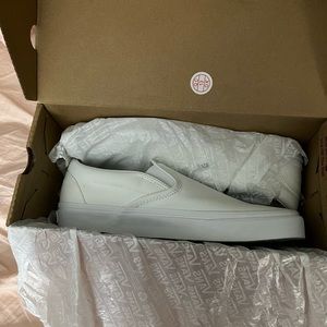 white slip on vans